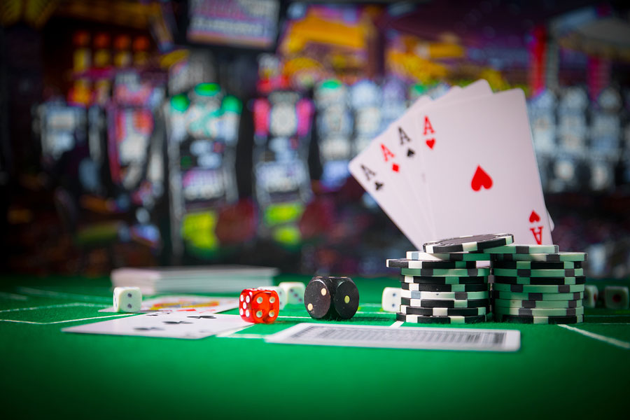 Cards and chips on green felt casino table