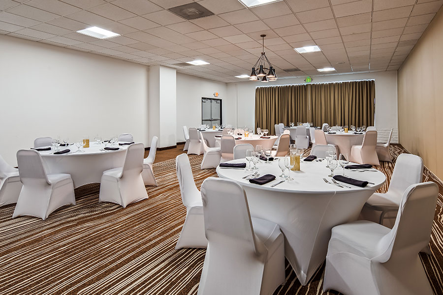 meeting and event space with round tables and chairs